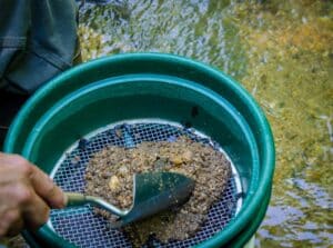 Gold panning and gem mining. Prospecting tool of classifier used to sift and sort material. Classify mineral rich soil, dirt, pebbles and stones. Prepare soil to pan. Fun, adventure and recreation.