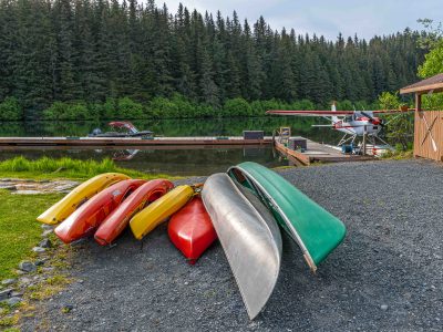 SEWARD, ALASKA - JUNE 6 - Lake front property with seaplane and kayaks on June  6 2019 on Bear Lake near Seward Alaska.